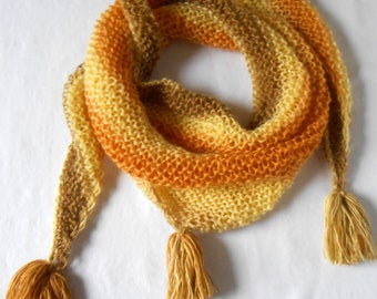 Hand-knitted wool scarf in a gradient of yellow, orange and light brown