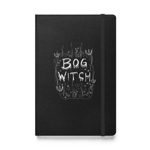 May include: Black notebook featuring a white design of a swamp with the text "BOG WITCH" in dripping letters.