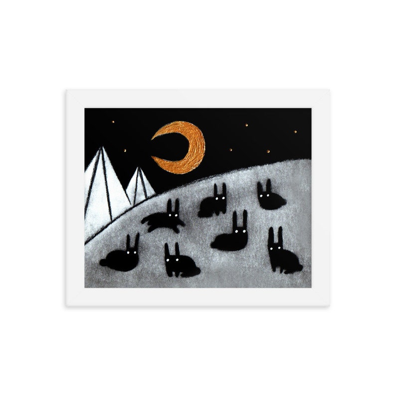 May include: A black and white illustration of a night scene with a crescent moon, two white mountains, and a group of black rabbits on a gray hill.