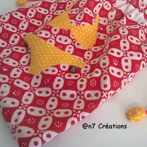 Underwear bag in red and yellow fabric.