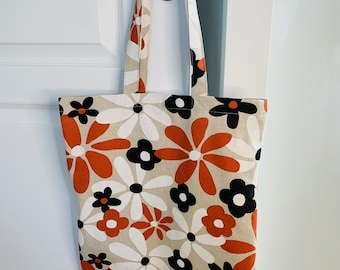 Tote bag à grandes fleurs oranges, noires et blanches