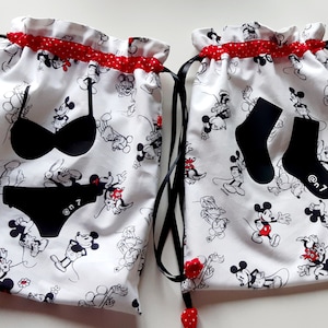White, black and red lingerie and sock bags.