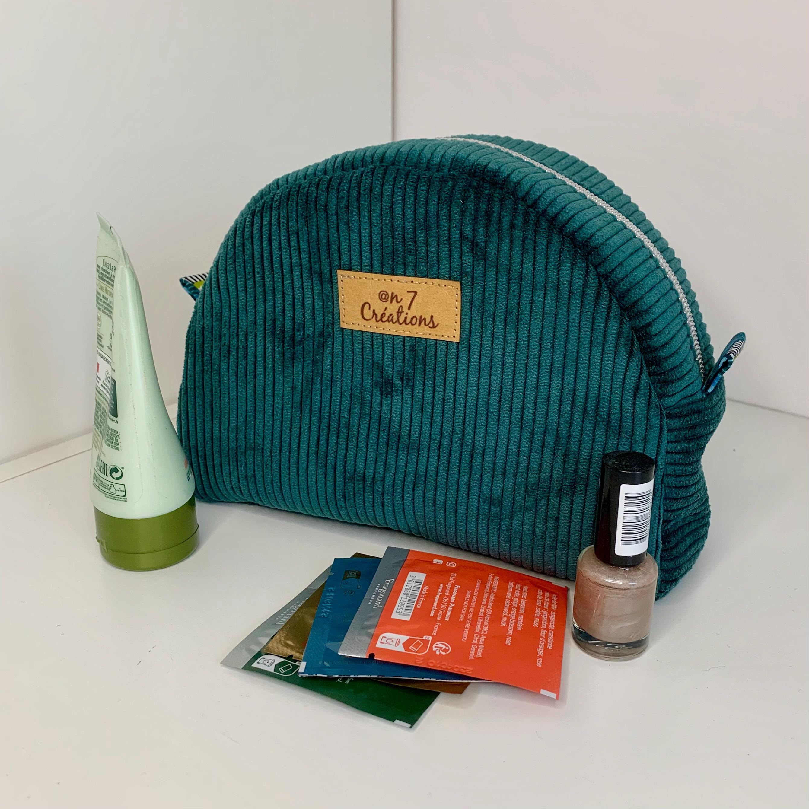 Half-moon makeup bag in duck green velvet