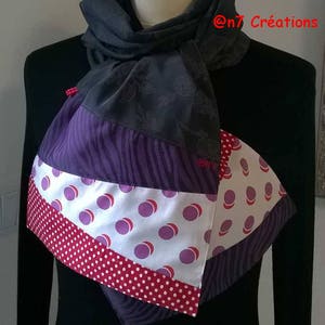 Lightweight scarf in gray, mauve, white and red fabrics.