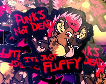May include: A black and red sticker featuring a cartoon hyena with pink hair and its tongue sticking out. The sticker reads "Punk's Not Dead It's Just Fluffy".
