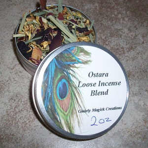 May include: A silver tin with a white label that reads "Ostara Loose Incense Blend" and "Gnarly Magick Creations". The tin contains a loose blend of herbs and flowers. The label also has a peacock feather design and the text "2 oz" written in blue ink.
