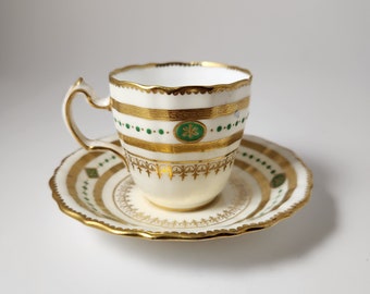 1873-1912 Mintons Demitasse Cup and Saucer made in England for Higgins & Seiter New York Hand Decorated Gold and Green Enamel