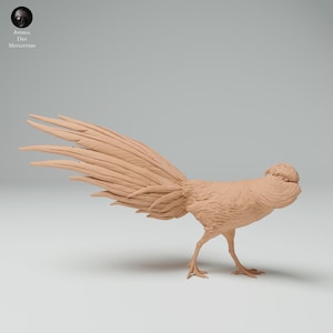 May include: A detailed, tan-colored pheasant miniature figurine. The bird has a long, flowing tail and detailed feather textures. The figurine is posed in a side profile, showcasing its delicate legs and beak. The Animal Den Miniatures logo is in the upper left corner.