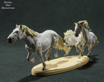 May include: Three white painted miniature horses running in a pack. The horses are posed in a dynamic, galloping motion. The miniatures are displayed on a light brown oval base.