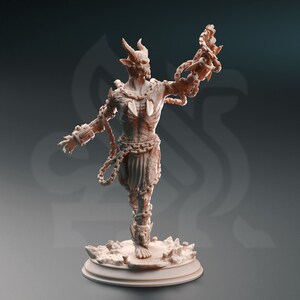 May include: A detailed, beige-colored figurine of a demonic creature with horns, chains, and a skeletal appearance. The figurine is standing on a rocky base.
