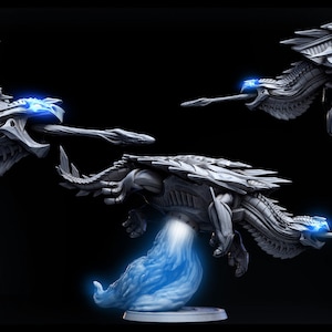 May include: A detailed, gray, 3D printed model of a dragon with wings, a long tail, and glowing blue accents. The dragon is posed in flight and is 235mm long.