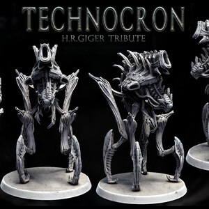May include: A gray, detailed, articulated, 3D printed model of a creature with a biomechanical design. The model is posed in four different views. The model is titled "TECHNOCRON H.R.GIGER TRIBUTE".