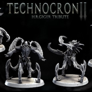 May include: Four detailed, gray, articulated, skeletal figures with wings and claws, standing on circular bases. The figures are part of a set called "Technocron II H.R. Giger Tribute".