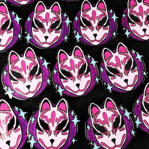 May include: Multiple pink and black enamel pins with a fox mask design on a purple glitter background. Each pin has a white outline and blue glitter stars.
