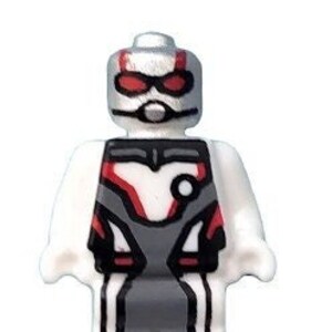 May include: A white Lego minifigure of Ant-Man wearing a red and gray suit with a white helmet and red visor.