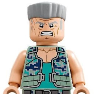 May include: A Lego minifigure of a man with gray hair, a green and blue camouflage vest, and a matching camouflage pants.