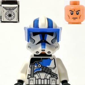 May include: A blue and white Lego minifigure of a Star Wars clone trooper with a blue helmet and visor. The figure has a black and gray chest piece with a blue and gray belt. The figure is holding a black and gray blaster rifle.