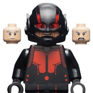 May include: A black and red Lego minifigure of Ant-Man, a superhero from the Marvel universe. The minifigure has a black suit with red accents and a black helmet with red eyes.