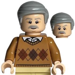 May include: A Lego minifigure of an older man with gray hair and a mustache. He wears a brown sweater with a diamond pattern and tan pants. An extra head is included. The figure has tan hands and a neutral expression.