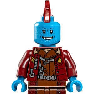 May include: A blue Lego minifigure with a red mohawk, wearing a brown and red jacket with a brown belt and brown pants.
