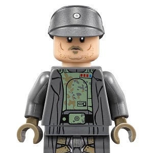 May include: A gray LEGO minifigure of a Star Wars Imperial Officer with a black and gray uniform, a black belt, and a gray hat with a white button. The figure has a camouflage pattern on the chest and a black and gray face with a mustache.