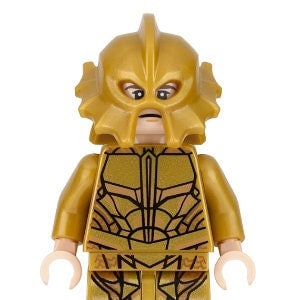 May include: A gold LEGO minifigure of a character wearing a gold helmet with a face mask and a gold suit with a detailed pattern.