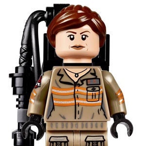 May include: A plastic minifigure with brown hair wearing a tan jumpsuit featuring orange reflective stripes, a black collar, and a black backpack accessory with a hose. The figure has black hands, black boots, and printed details on the torso.