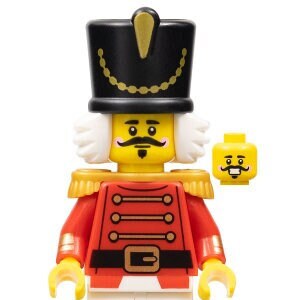 May include: A Lego minifigure of a toy soldier wearing a red and gold uniform with a black hat and white beard. The figure has a mustache and a friendly expression.