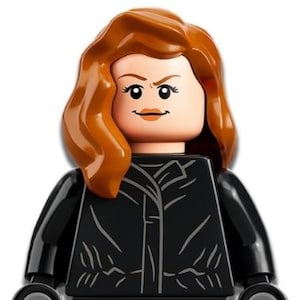 May include: A Lego minifigure of a character with auburn hair and a stern expression. The figure wears a black outfit with a detailed jacket design. The arms and legs are also black, and the hands are curved.