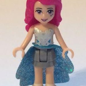 Lego MINIFIGURE Friends Livi - Flat Silver Layered Skirt, White Top with Metallic Geometric, Dark Azure Sequined Cloth Skirt