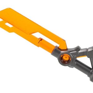 May include: An orange and gray toy sword with a rectangular blade and a detailed handle. The blade has two rectangular cutouts. The handle is gray with orange accents.