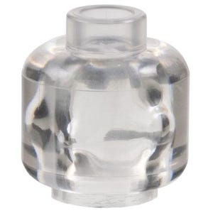 May include: A clear, transparent plastic minifigure head piece with a smooth, rounded shape and a cylindrical stud on top for attachment. The object features a hollow bottom opening designed to fit onto a standard building block torso component.