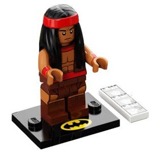 May include: A Lego minifigure of a Native American character with long black hair, a red headband, and brown clothing. The figure stands on a black base with a yellow Batman logo. A white tile with a printed design is next to the figure.