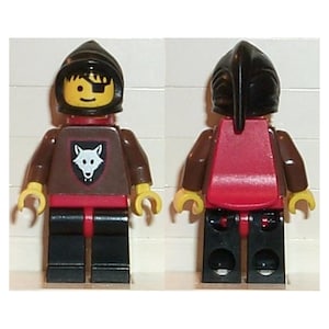 May include: A Lego minifigure shown from the front and back, wearing a black helmet, a brown torso with a white wolf emblem on a black shield, red waist piece, and black legs. The face features a yellow complexion with a black eye patch.