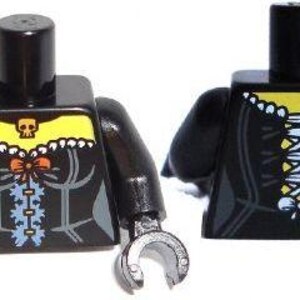 May include: Two black plastic toy figure torsos with arms and hands. The left torso features a yellow neckline with a skull icon, a small orange bow, and blue lacing details. The right torso displays a yellow neckline and a central blue corset lacing.