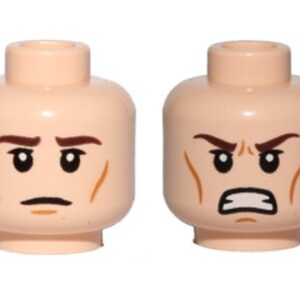 May include: Two Lego minifigure heads with different expressions. The head on the left has a neutral expression with furrowed brows and a slight frown. The head on the right has an angry expression with furrowed brows, a frown, and a gritted teeth expression.