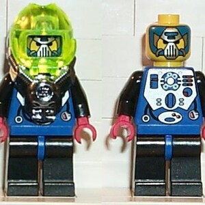 May include: Two Lego minifigures, one with a black and blue suit and a translucent green helmet, the other with a black and blue suit and a yellow helmet with a black face.