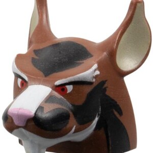 May include: A brown and black figurine of a stylized animal head with red eyes, white accents, and a pink nose. The ears are tan on the inside. The figurine has a fierce expression.