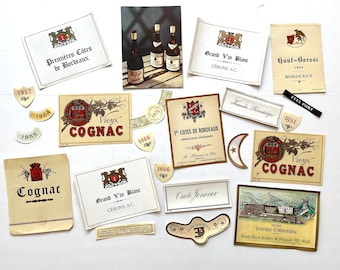 May include: A collection of vintage wine and cognac labels, including "Premières Côtes de Bordeaux", "Grand Vin Blanc", "Haut-Barsac", "Vieux Cognac", and "1er Côtes de Bordeaux". The labels are printed on white paper with red, gold, and black lettering.