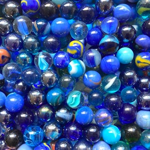 100 blue marbles, vintage and modern 16 mm marbles, mix of blue toned marbles including translucent, swirls and clearies, target marbles