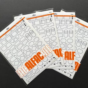 May include: A white ceramic mug with a black handle and the text "But First, Coffee" in a black, handwritten-style font. The mug is on a white surface.