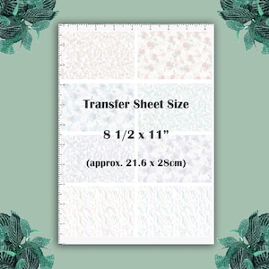 May include: A white transfer sheet with a variety of patterns, including floral and abstract designs. The sheet measures 8 1/2 inches by 11 inches, or approximately 21.6 centimetres by 28 centimetres.