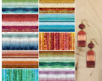 May include: A sheet of 10 polymer clay transfer designs with 8 different color blends. Each design is 4 inches by 2 inches. The sheet is 8.5 inches by 11 inches. The designs are abstract and feature a variety of colors, including red, blue, green, and yellow. The sheet also includes instructions for using the transfers.