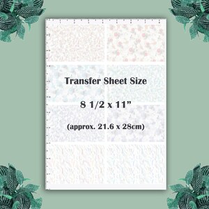 May include: A white transfer sheet with a variety of patterns, including floral and abstract designs. The sheet measures 8 1/2 inches by 11 inches, or approximately 21.6 centimeters by 28 centimeters.