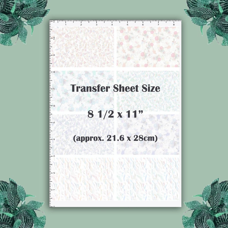 May include: A white transfer sheet with a variety of patterns, including floral and abstract designs. The sheet measures 8 1/2 inches by 11 inches, or approximately 21.6 centimeters by 28 centimeters.