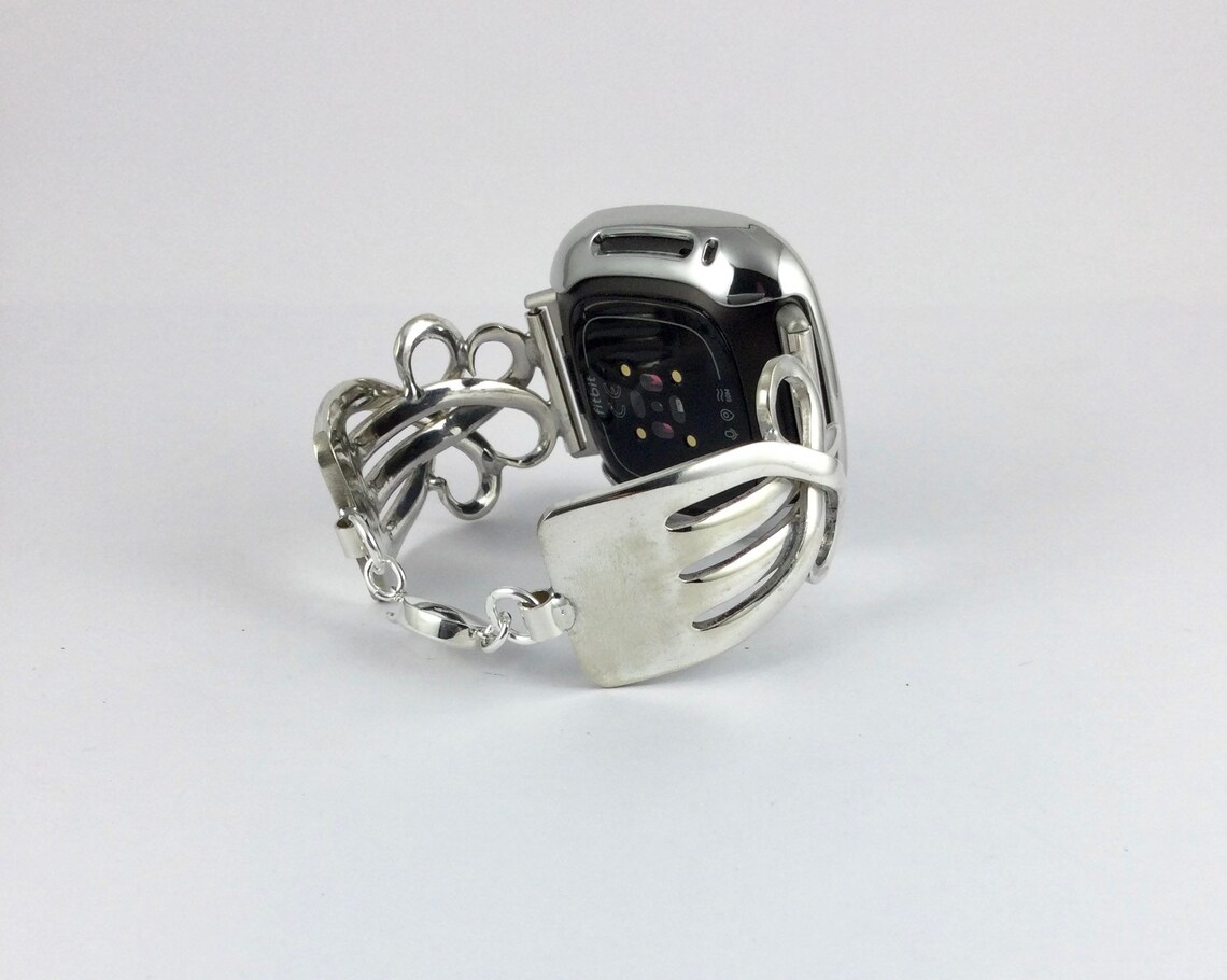 silver fitbit versa with black band