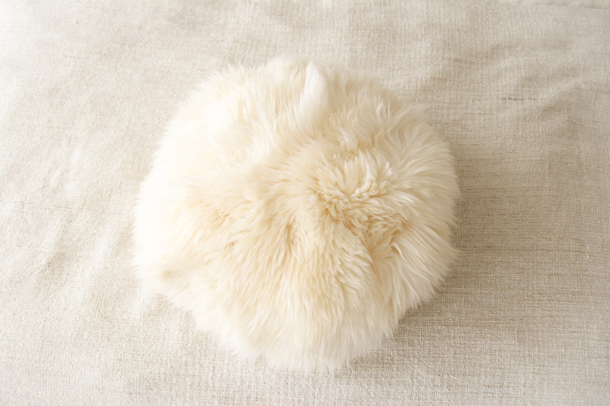 round faux fur pillow