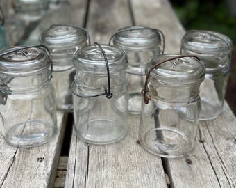 Lot of 6 unbranded vintage glass pint canning jars with glass tops and wire bails  062610808