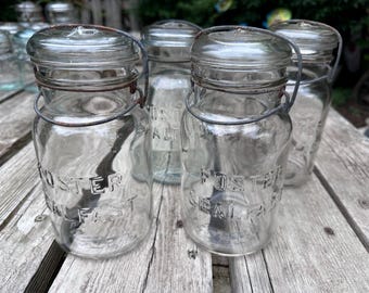 Lot of 4 Foster Sealfast clear quart glass canning jars with glass tops and wire bails. 06262078