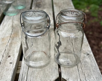 Lot of 2 Hazel Atlas quart clear glass canning jars with glass top and wire bail  062680099
